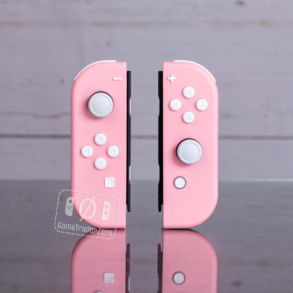 Pink Joy-Cons with white buttons.
