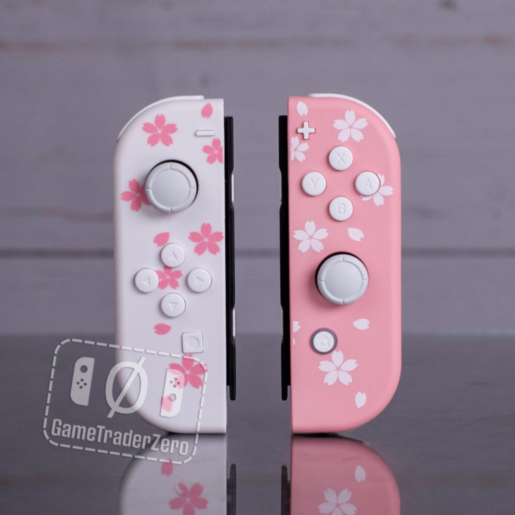 Cute custom joycons in pink and white with flower prints.