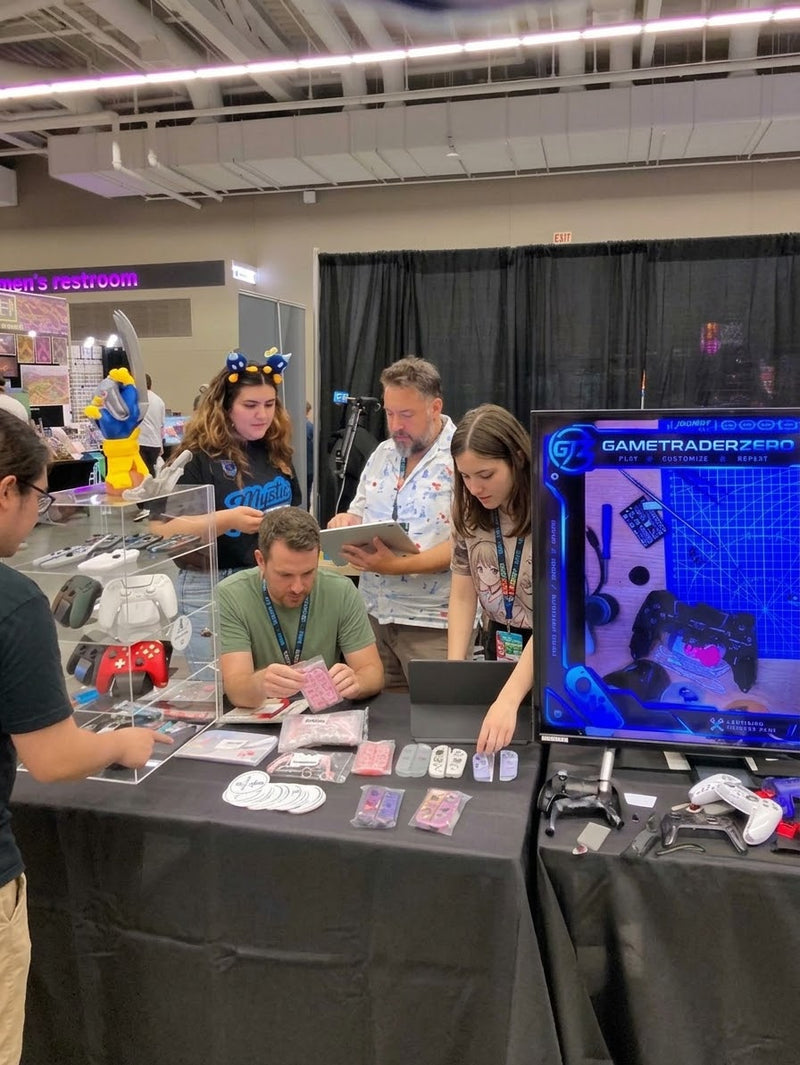 Visitors gather at the GameTraderZero booth at Cleveland Gaming Classic