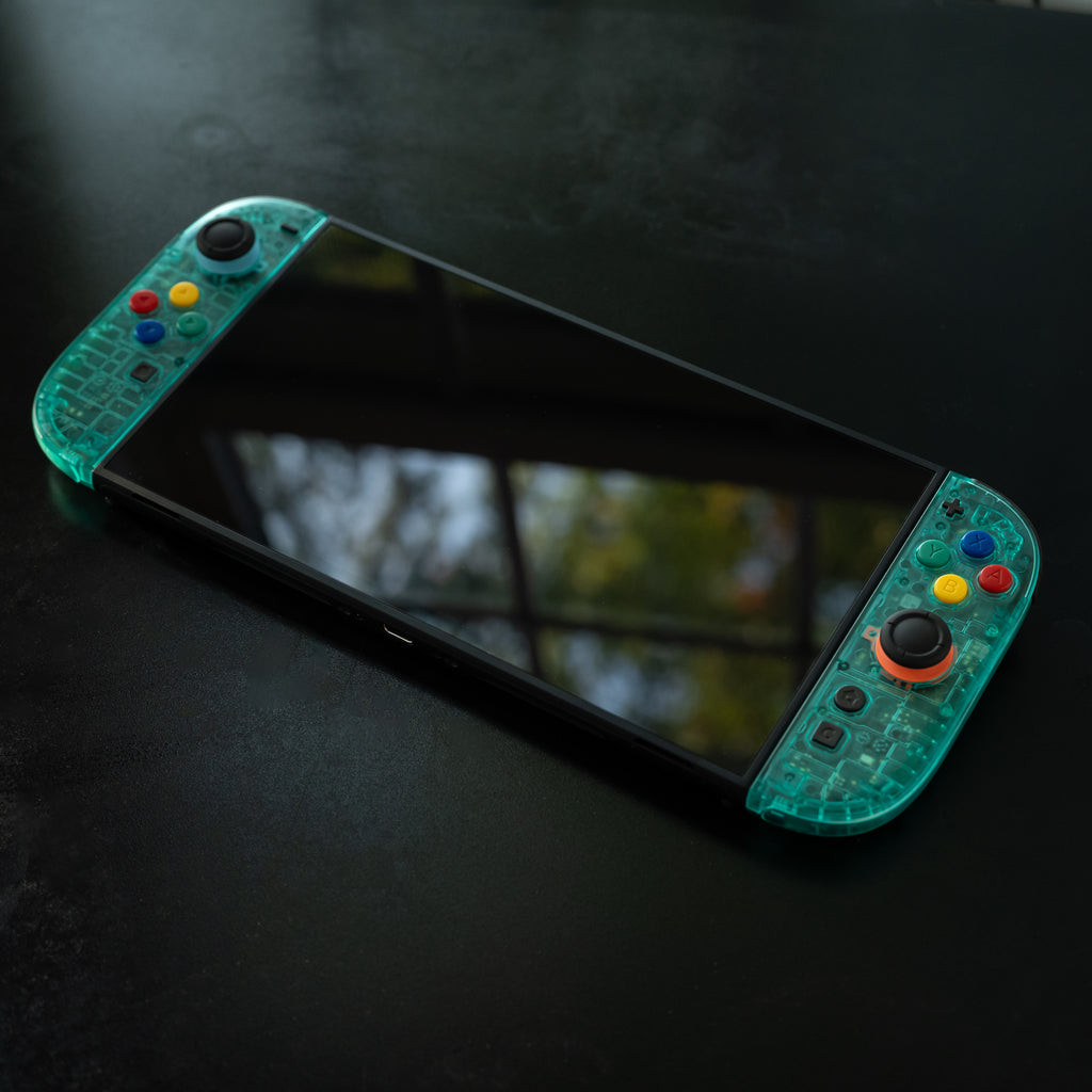 Translucent teal Switch 2 Joy-Cons with SNES buttons