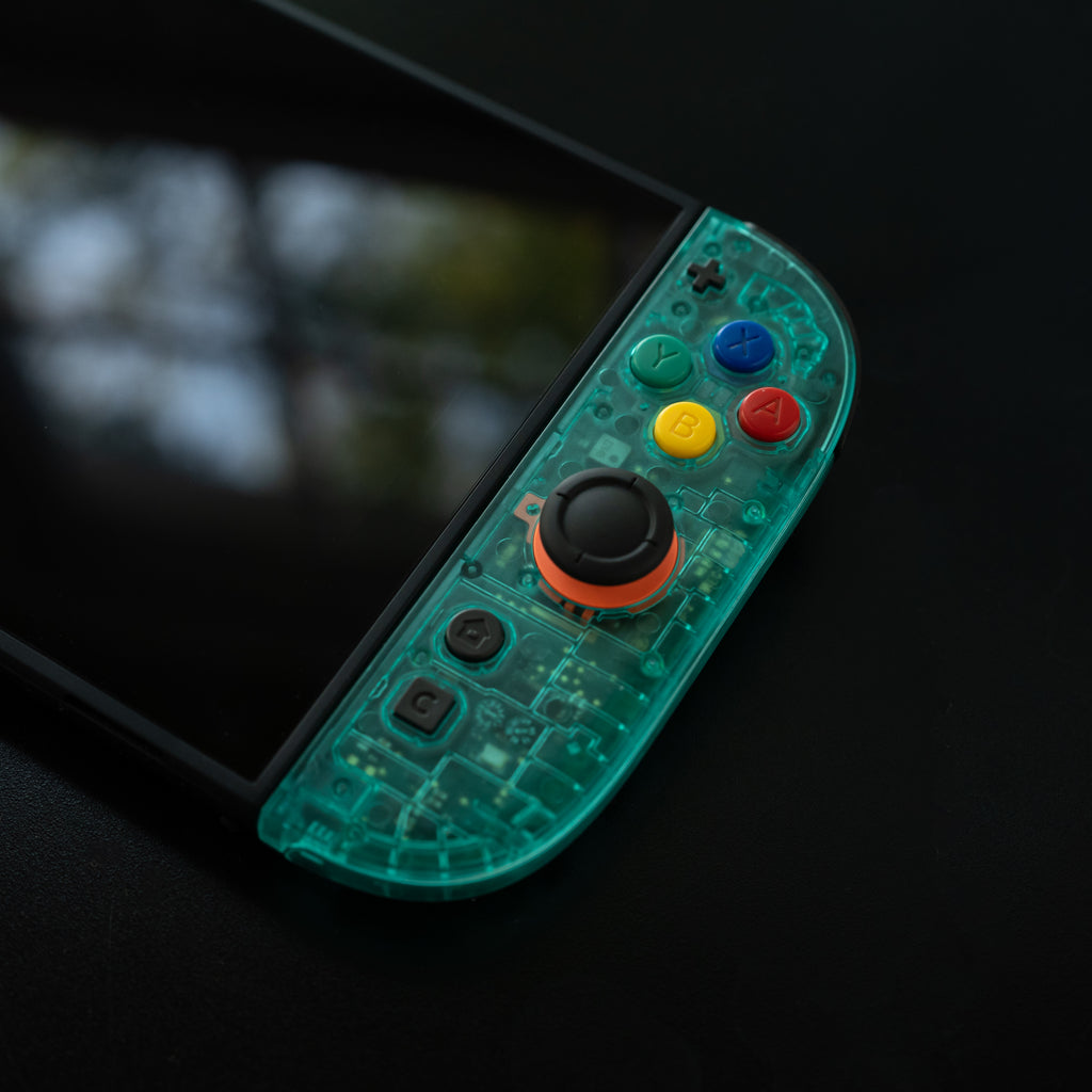 Clear teal Switch 2 Joy-Cons with SNES buttons