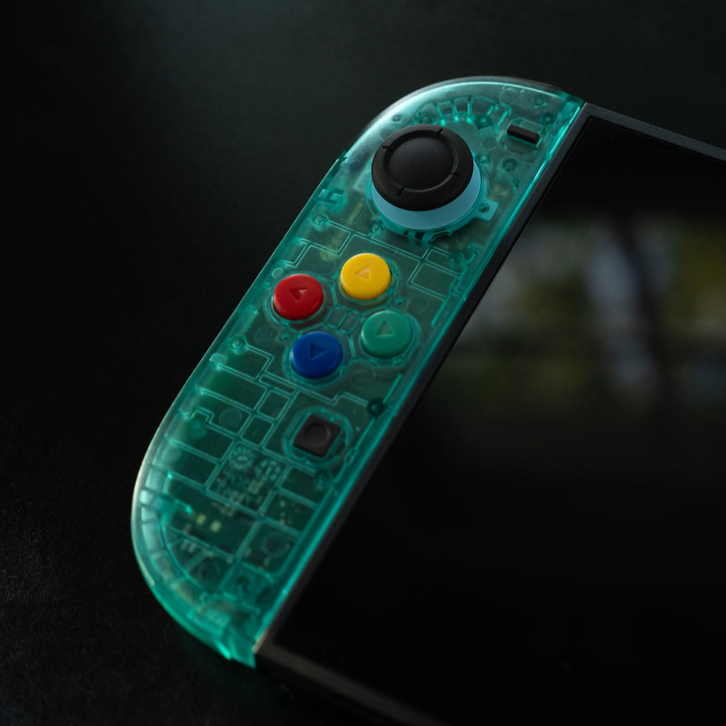 Translucent teal Switch 2 Joy-Cons with SNES buttons