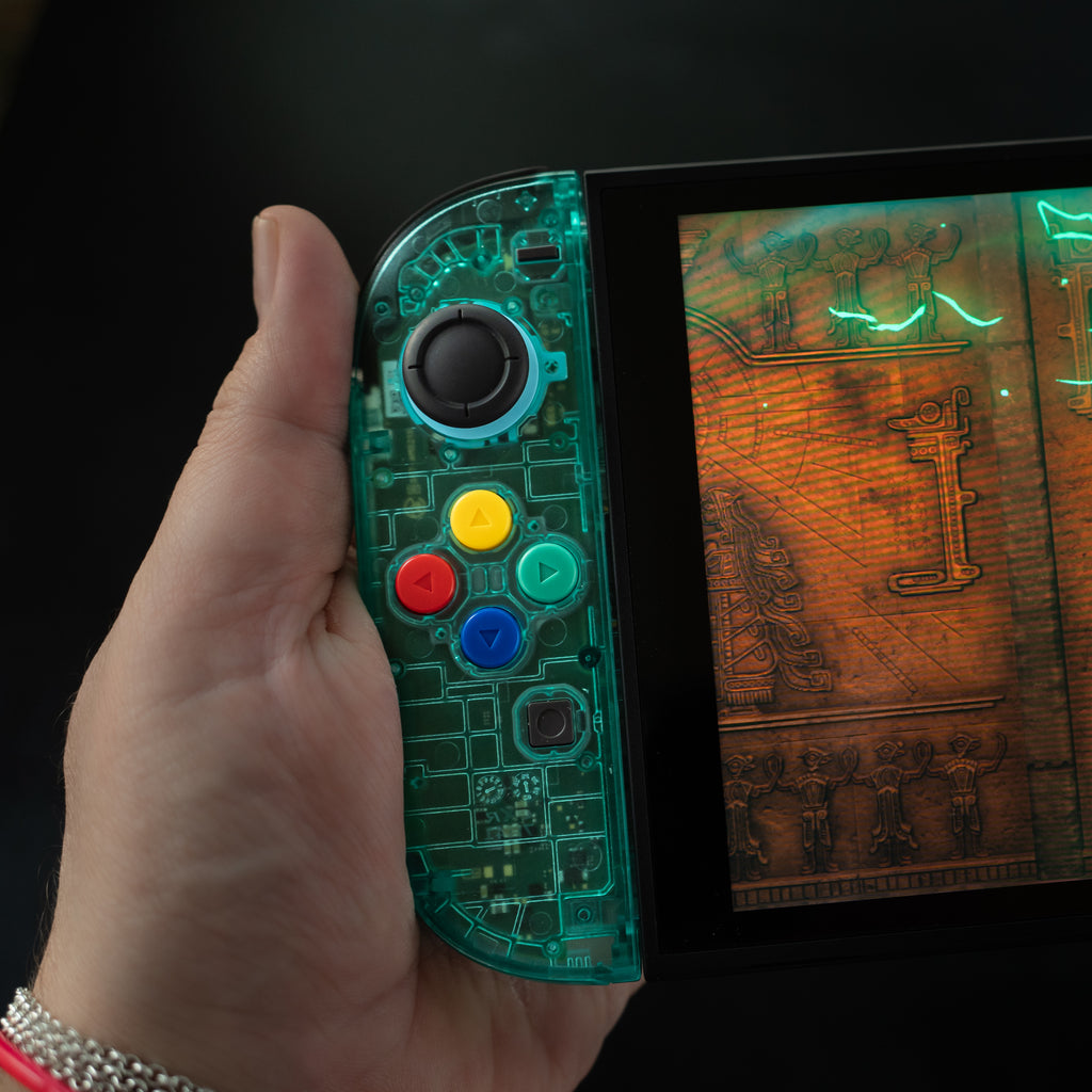 Translucent teal Switch 2 Joy-Cons with SNES buttons