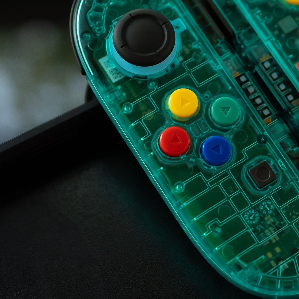 Translucent teal Switch 2 Joy-Cons with SNES buttons