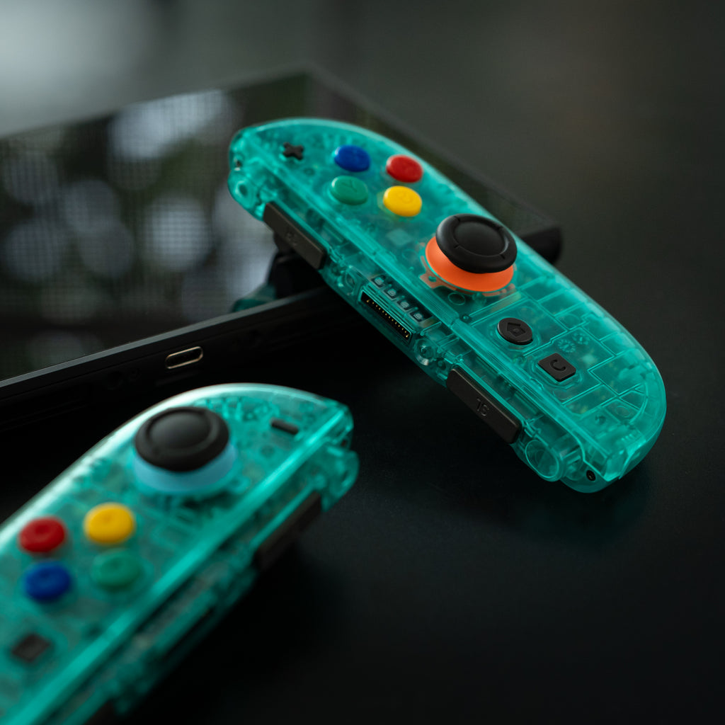 Translucent teal Switch 2 Joy-Cons with SNES buttons