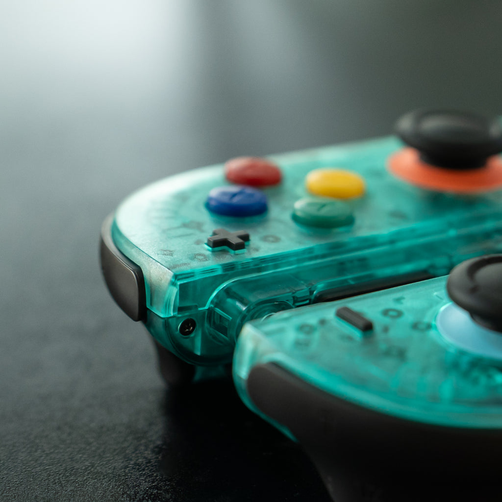 Translucent teal Switch 2 Joy-Cons with SNES buttons