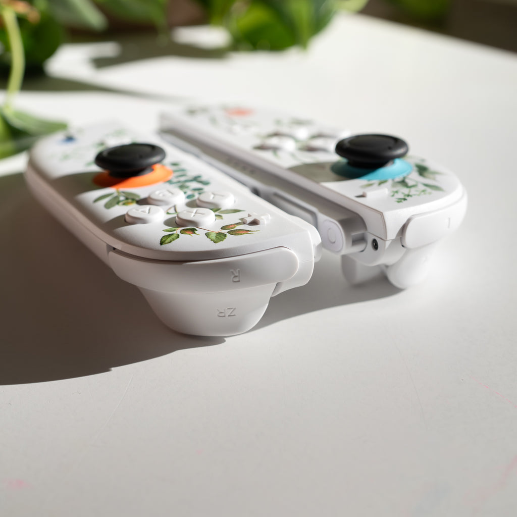 Custom Switch 2 Joy-Cons with a floral print and custom white buttons