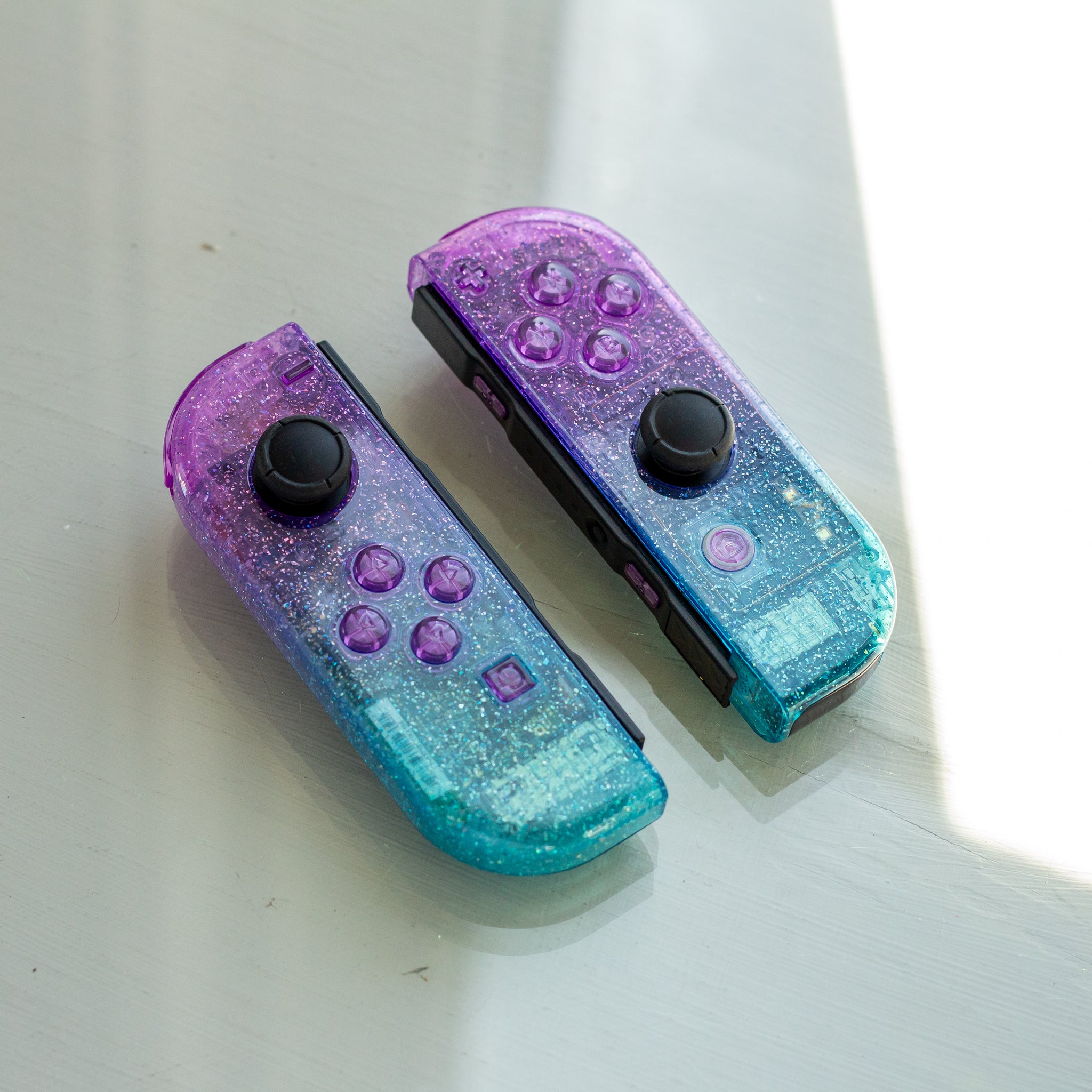 Cosmic Glitter Joy-Cons Clear Purple and Emerald Nintendo Switch 