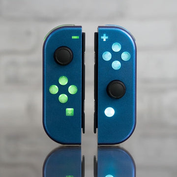 custom joycons with LED backlit buttons in chameleon color shifting shells.